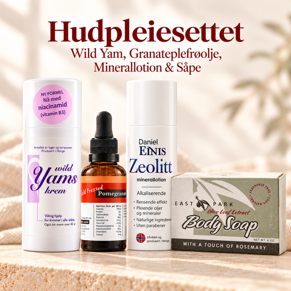 Hudpleiesettet med Wild Yam-krem, granateplefrøolje, Zeolitt Minerallotion og Oliven & Rosmarin-såpe på en lys steinplate